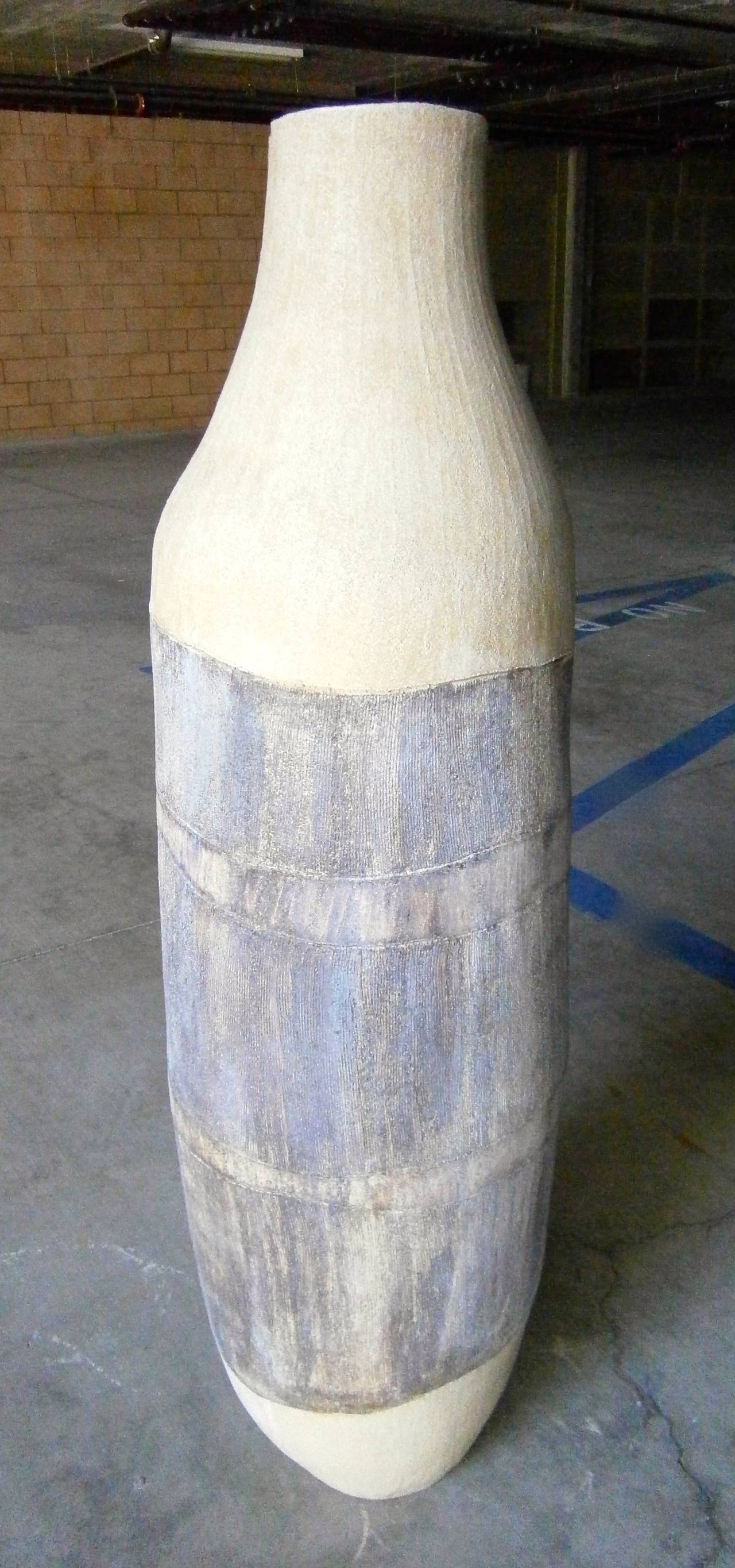 A large scaled studio pottery ceramic floor vase, custom made for noted interior designer Steve Chase and acquired from a home designed by him in 1994. This piece was obtained along with another large pottery vase that is signed JW '94 and can be