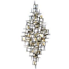 A vintage 1960
s hand wrought abstract metal wall sculpture