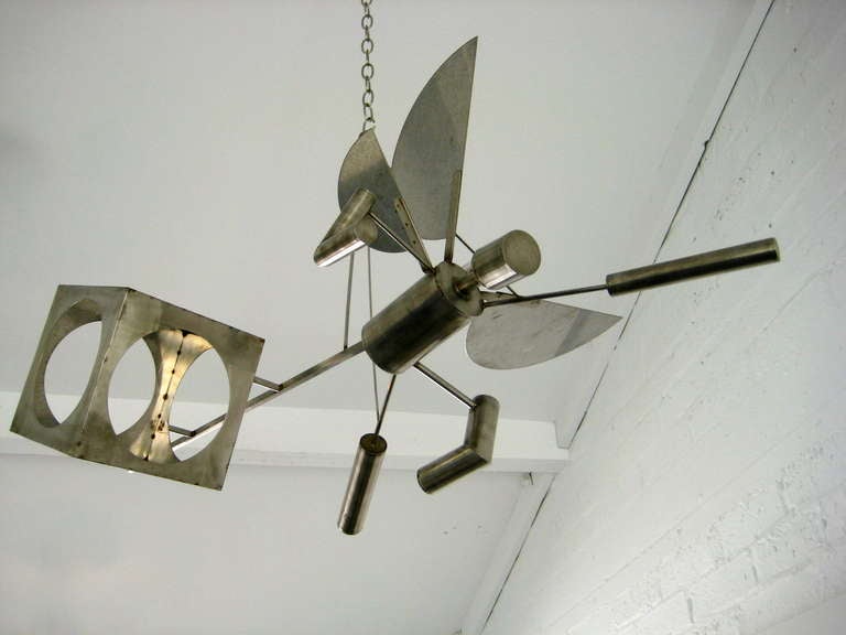 A steel hanging sculpture titled 