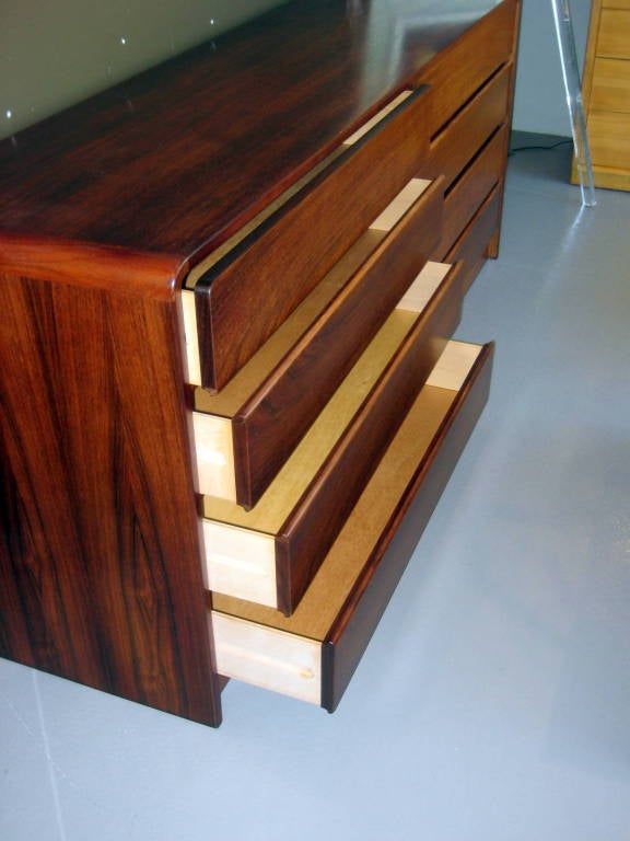 A 1970's bookmatched rosewood 8 drawer chest with waterfall edge 5