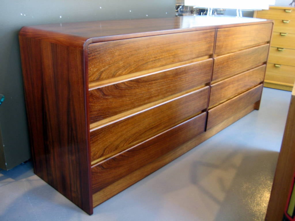 American A 1970's bookmatched rosewood 8 drawer chest with waterfall edge