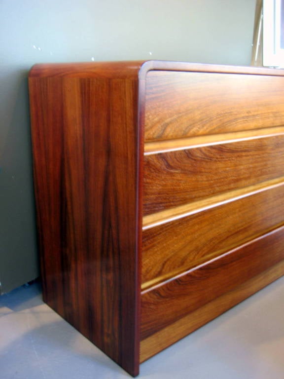 Late 20th Century A 1970's bookmatched rosewood 8 drawer chest with waterfall edge