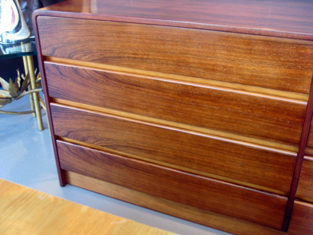 A 1970's bookmatched rosewood 8 drawer chest with waterfall edge 1