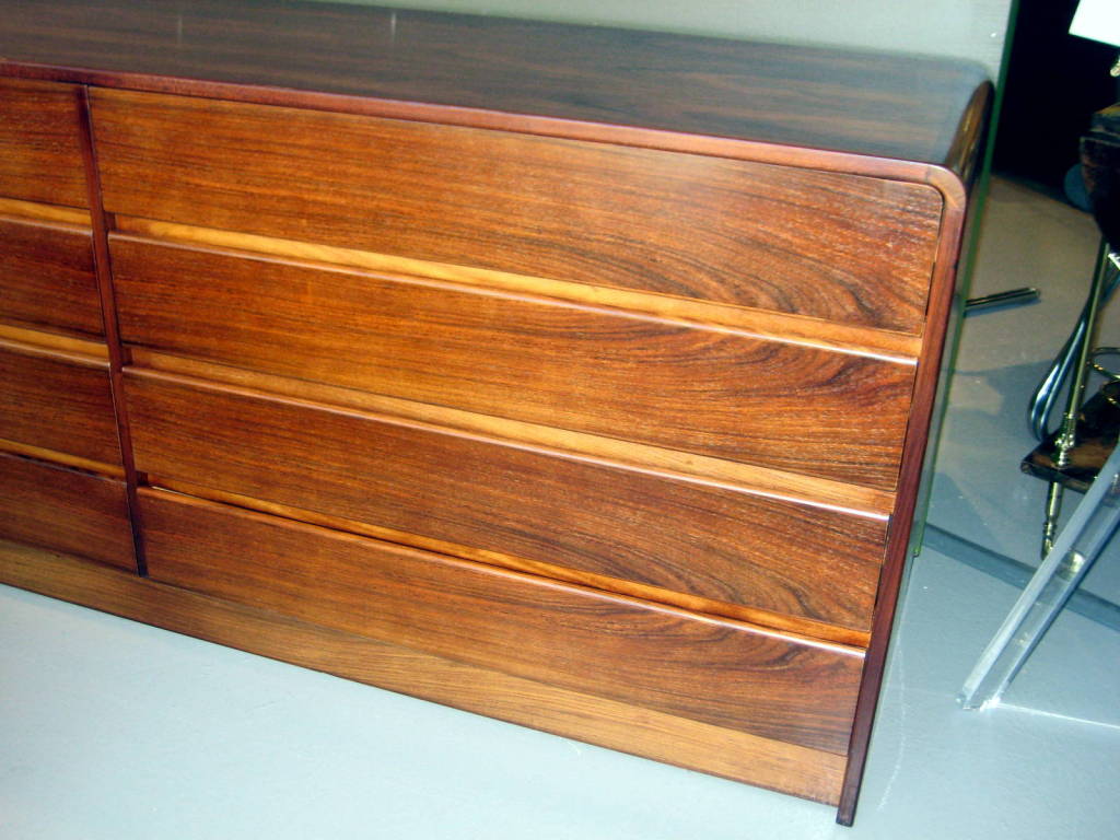 A 1970's bookmatched rosewood 8 drawer chest with waterfall edge 2