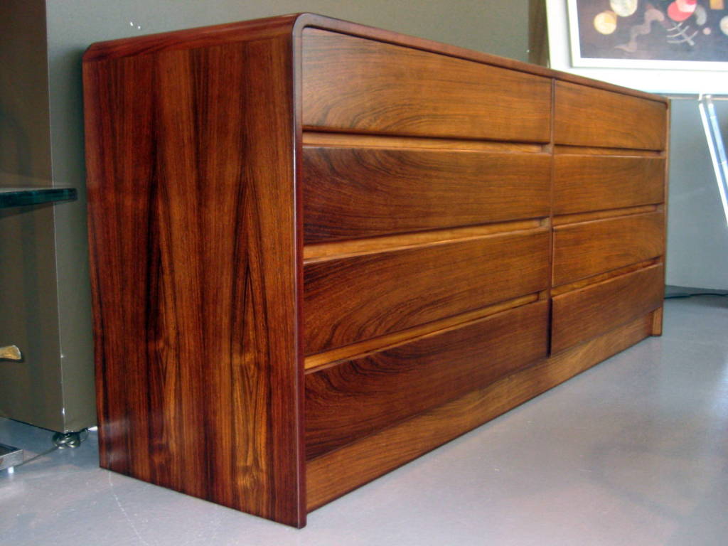 A 1970's bookmatched rosewood 8 drawer chest with waterfall edge 4