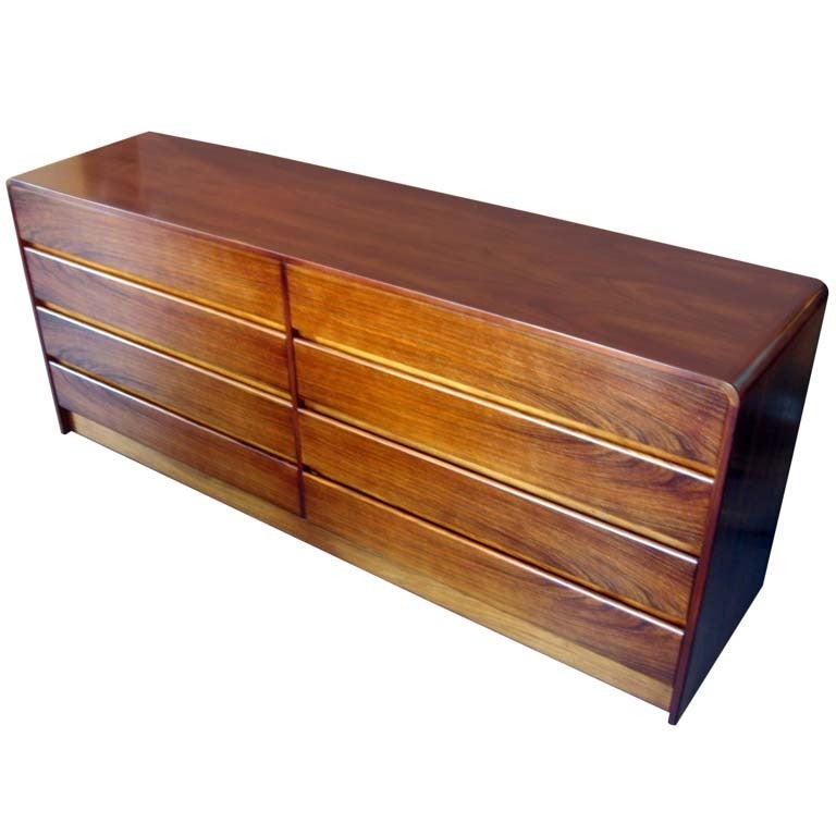 A 1970's bookmatched rosewood 8 drawer chest with waterfall edge