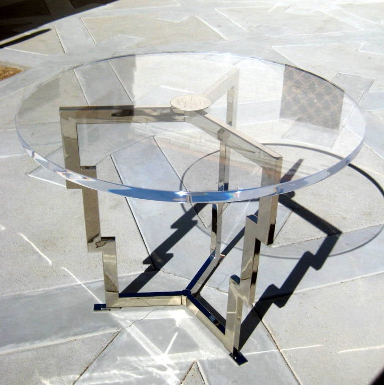 A custom-made nickel-plated steel and acrylic center table with 