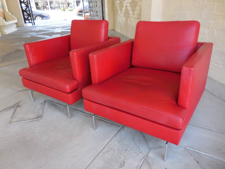 A dazzling pair of classically modern red leather club chairs by Didier Gomez.
From his 