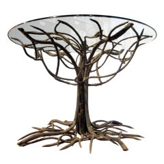 An outstanding wrought iron "tree form"  table base w/ glass top