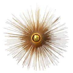 "Supernova" A Polished Brass Three-Tier Radiant Wall Mounted Sculpture, c. 1960s