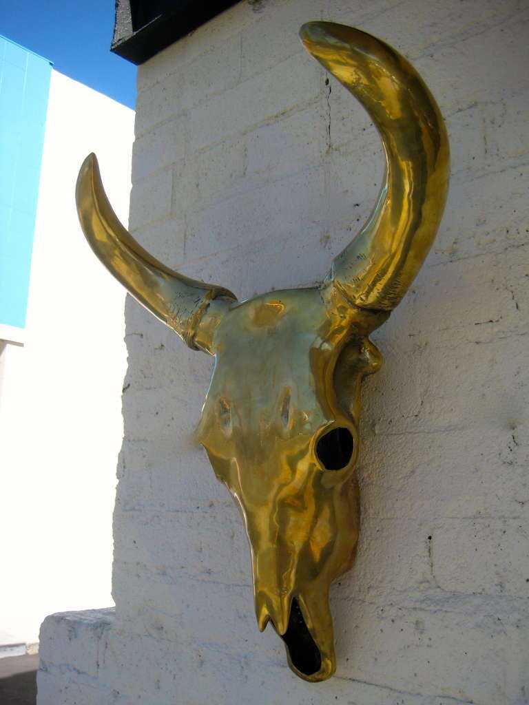 A dynamic and large scale solid polished brass sculptural cow skull c.1970's