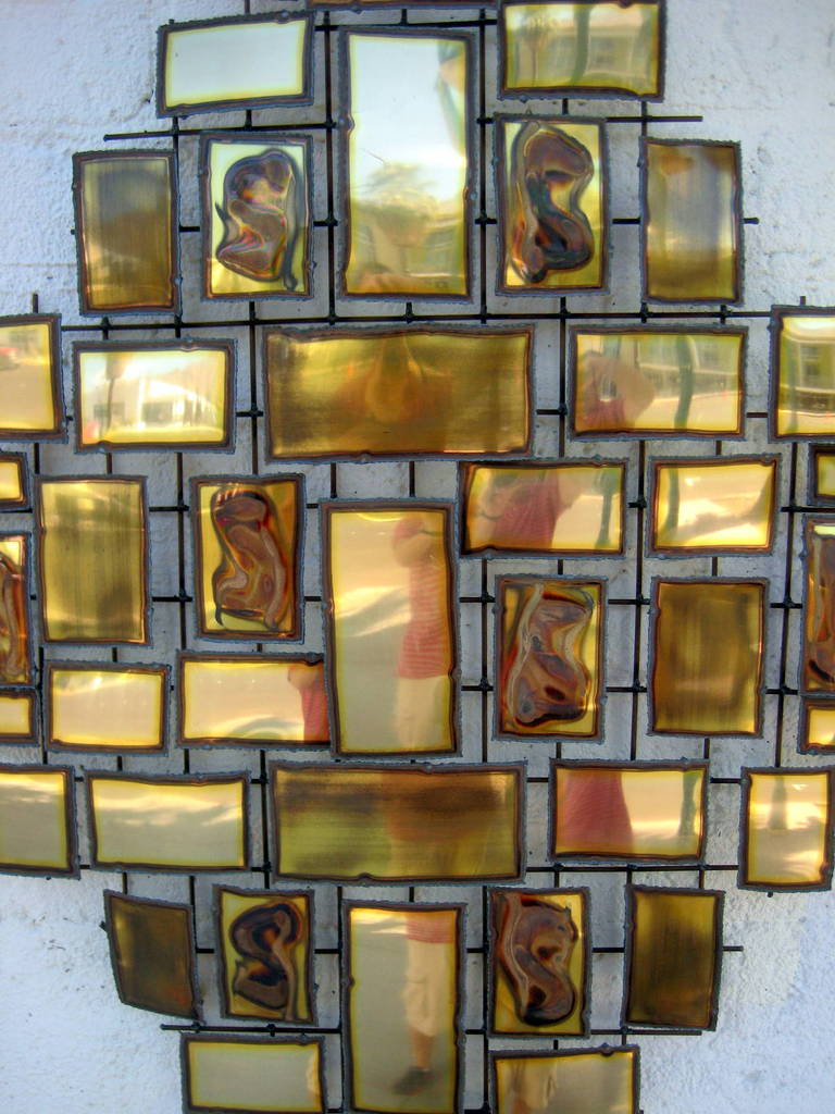 Mid-Century Modern A polished and burnished brass metal wall sculpture by 
