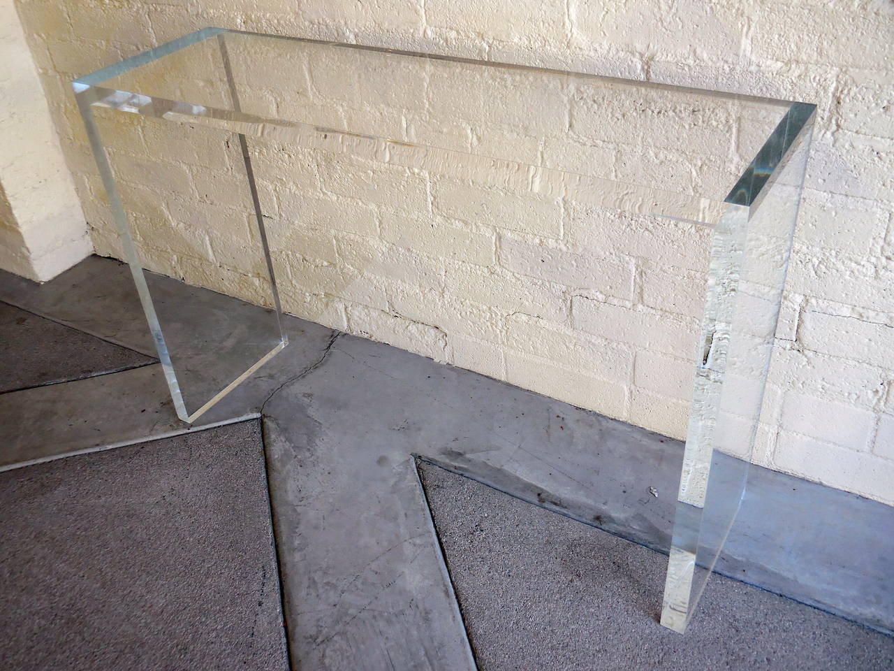 A sparkling and sleek Minimalist console table by Carmichael Furniture. The table is made from 1.5