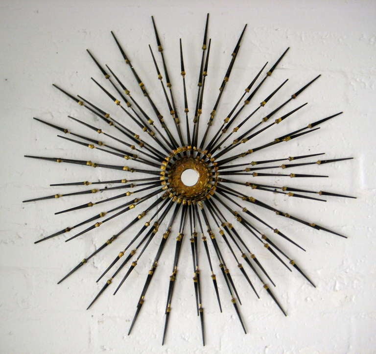 A contemporary welded steel, gold leaf and mirror wall sculpture by California artist Del Williams.  Formed from hand wrought nails that 