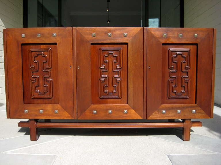 A very rare and super fantastic Mexican MId-Century Modern three door sideboard by American designer Edmund J. Spence. Spence made a career of designing Swedish and Mexican style furniture, which he had produced in Sweden and Mexico, using local