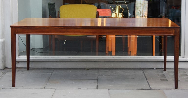 Dramatic Rio Rosewood Diplomat table designed by Finn Juhl and made by France & France. The top has lightened to a dramatic play of light and dark colours. Great original condition