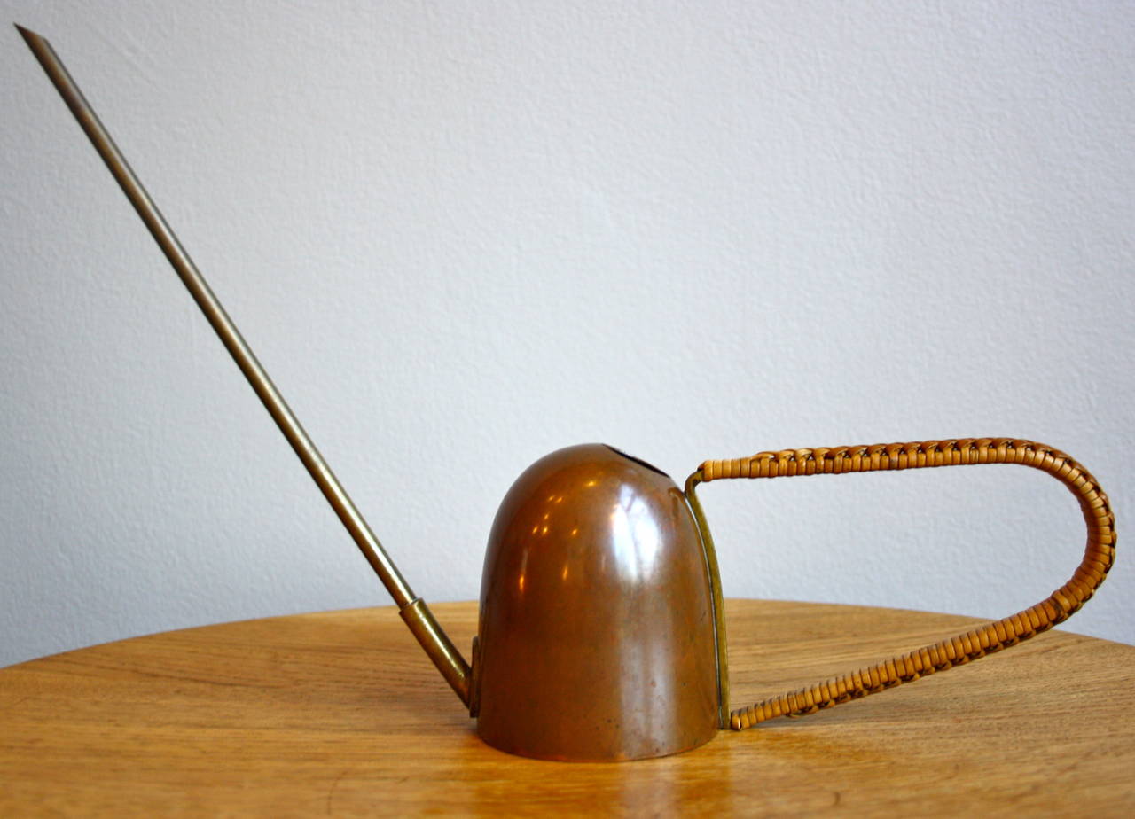 Copper body, brass spout and wicker rapped handle small-scale watering can from the fantastic Vienna workshop of Carl Aubock. Great condition and patina to both the body and the wicker.