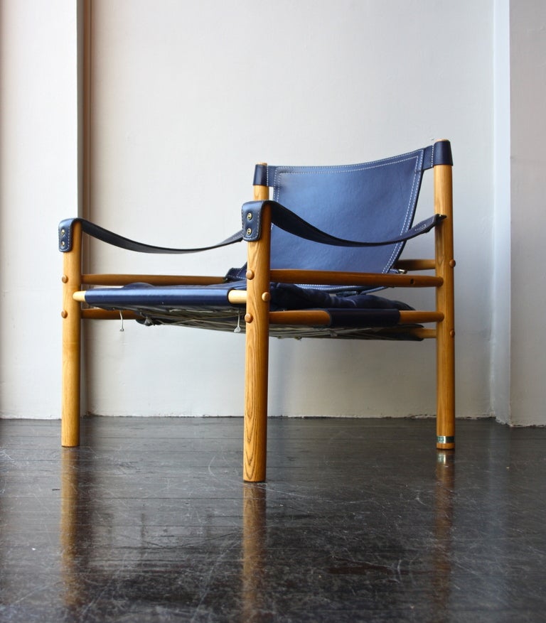 A strong leather armchairs by Arne Norell . Oak frame and great bright blue leather with some patina. In great condition.