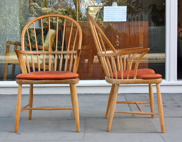 Pair of Fritz Henningsen oak Windsor chairs in superb original condition.  Solid oak and original red leather seat cushions.
