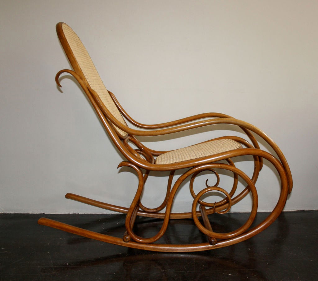 Original Austrian rocking chair by Fischel. Newly hand caned seat and back