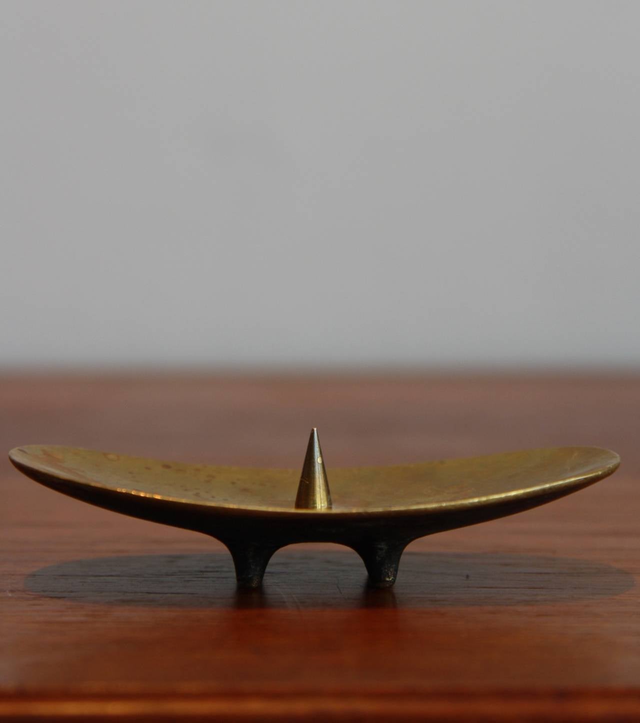 Inspired by traditional African shapes this candleholder is a beautiful sculptural piece of Classic Auböck.