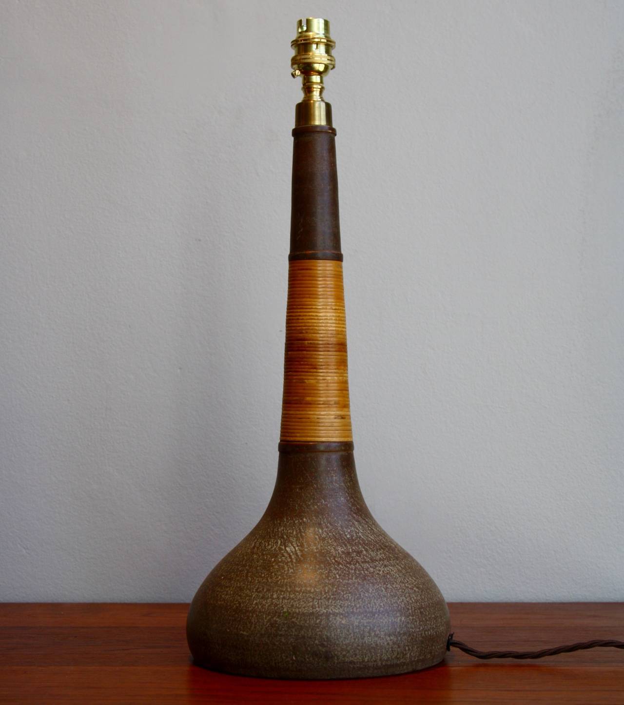 Great hand thrown table light with original wicker stem.