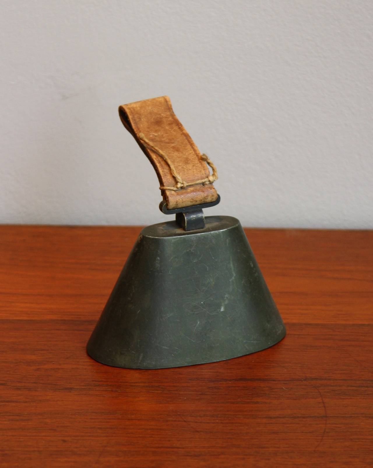 Mid-1940s bell by Carl Auböck with the original leather handle and stitching. Very rarely seen piece in a good condition. From a Viennese collection and first time being dealt since the 1940s.