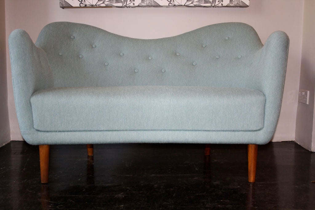 One of the few remaining on the open market of the early Finn Juhl sofas. Designed in 1946 this one has been dated by the structural materials used to no later than 1950, early for the Poet sofa. Completely restored and re upholstered in handwoven