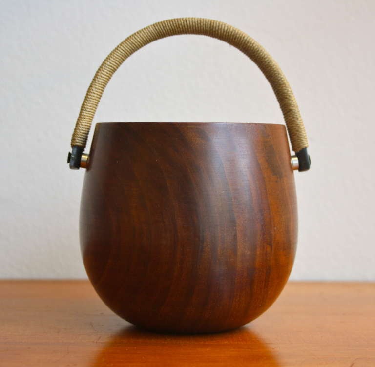 Turned Walnut bowl with a brass handle covered in string. Lovely piece in the classic Aubock materials. Great condition and patina throughout the piece.