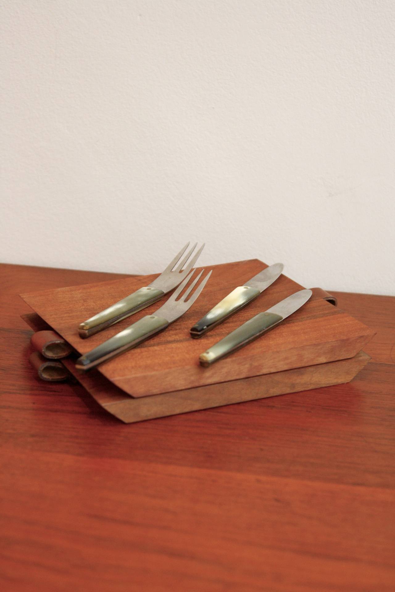 Pair of walnut boards with steel and horn cutlery. Lovely pair of classic Auböck  sculptural and utilitarian pieces for life.