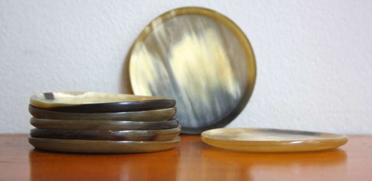 A rare and interesting set of coasters made from Austrian Cow Horn. Made in the tiny workshop by Carl Auböck in the 1950s this wonderful set shows how whatever material Carl put his hands to he could create items of such beauty.