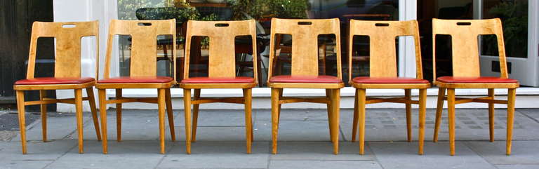 Beautiful set of Steam bent Chairs. With a gorgeous steam bent birch plywood back and frame.Orignal red leather seats. A really great set for a great price.