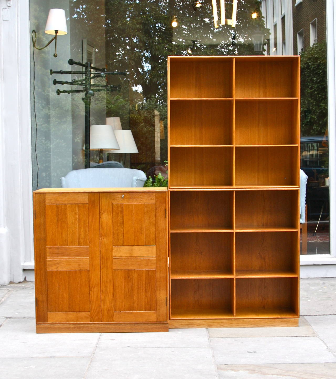 Great versatile set of two bookcase and one cabinet from the series designed by Mogens Koch for Rud Rasmussen Snedkerier. Very good condition.

Measurements below refer to the there units arranged as in the picture. 
Every unit has a squared