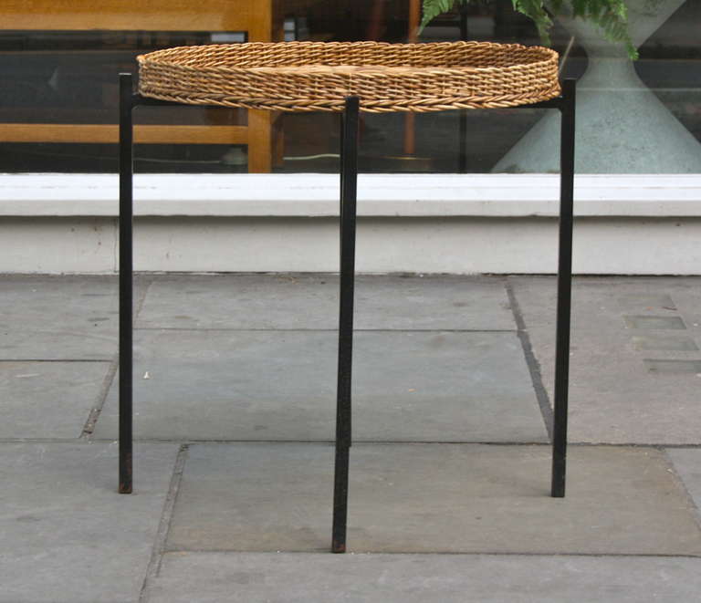 Lovely large wicker and black painted metal frame side table designed and made by Carl Auböck. Elegant as ever.