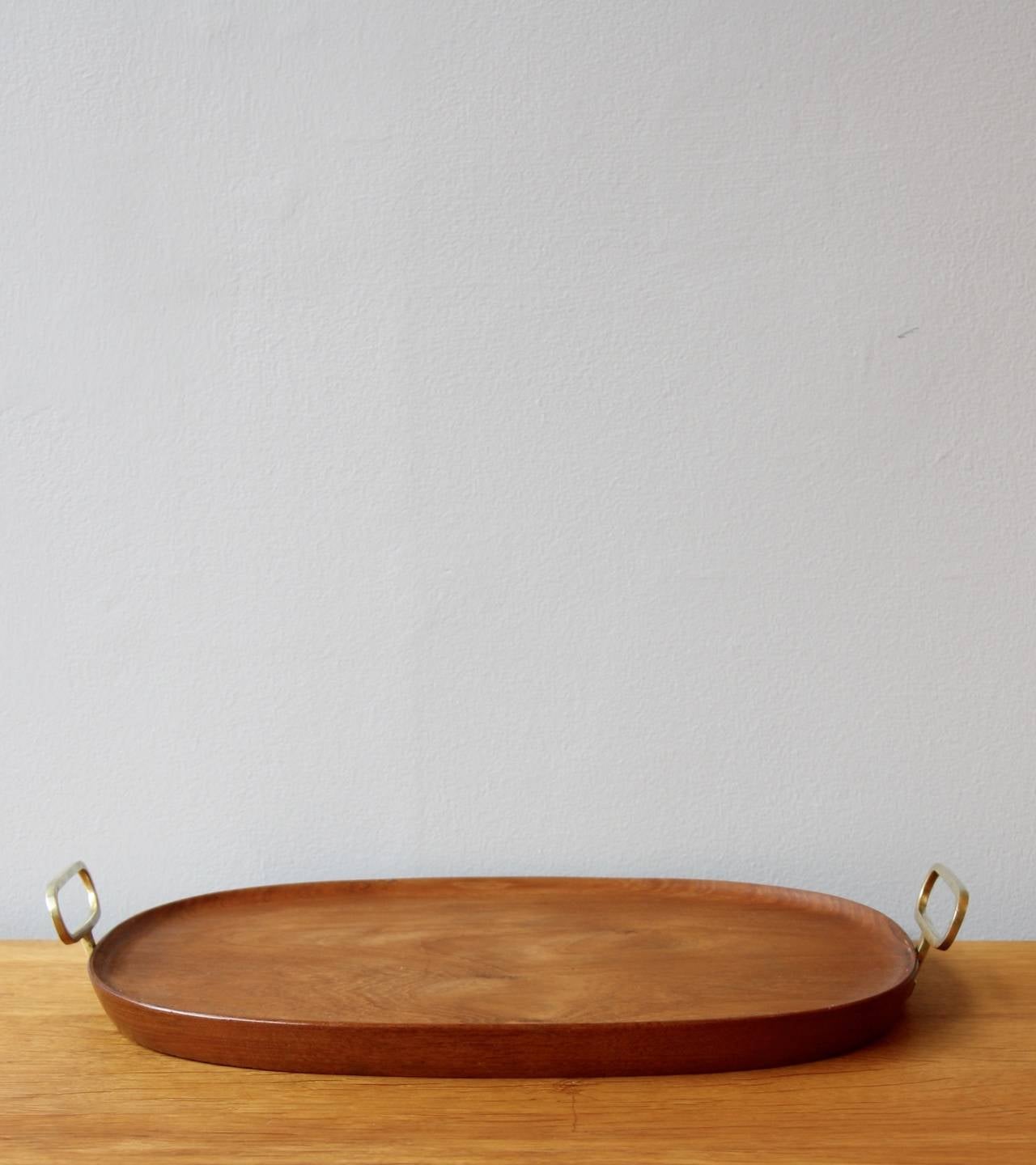 A gorgeous handmade walnut tray with great brass handles. All made in Vienna by the brass artisan Carl Auböck, wonderfully crafted and expertly finished. some great detailing on the cast brass handles.