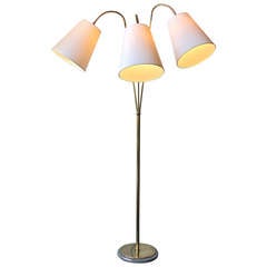 Elegant Three Headed Brass Floor light.