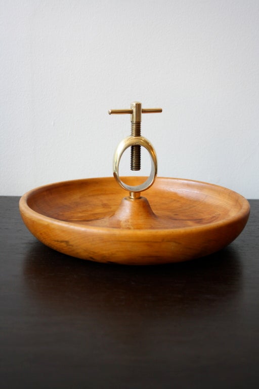 Fruit and nut bowl with a central nutcracker in brass by Carl Aubock. Lovely colour to the wood the removeable nutbracker is in great condition