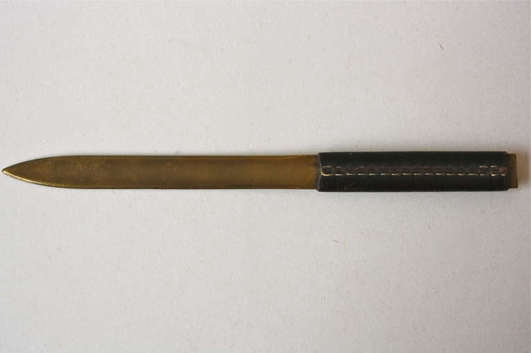 Brass and hand stitched original black leather letteropener designed and made in the workshop of Carl Aubock