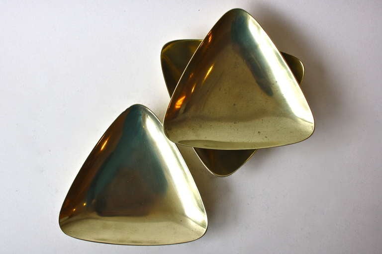 Solid brass ashtrays in a sculptural simple triangle. Beautifully made and proving much it to be said for the execution in the end result of an object.