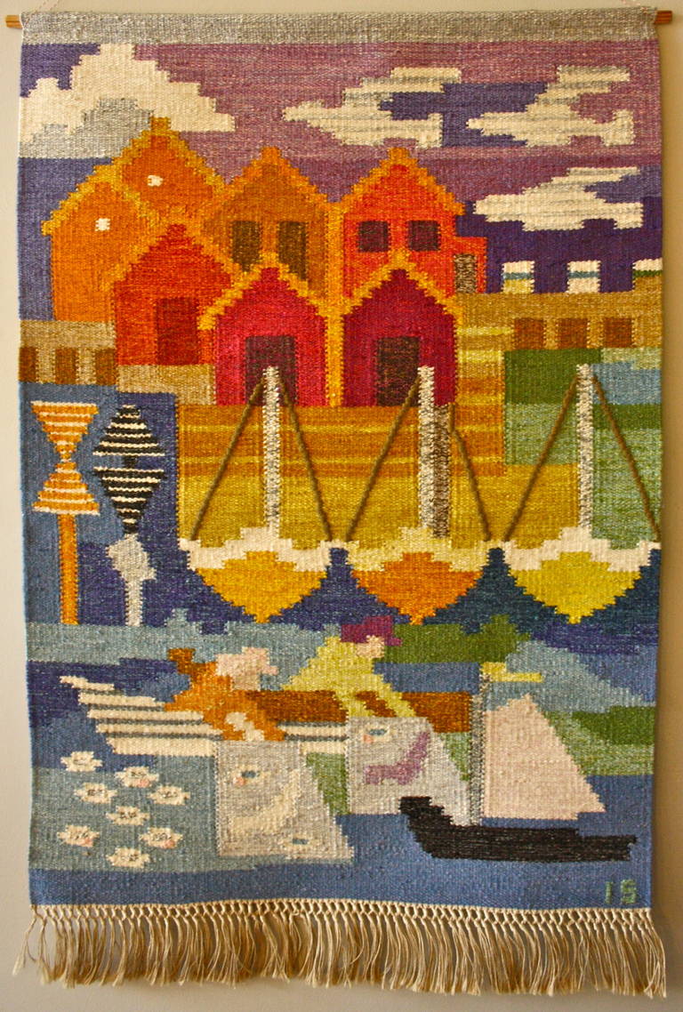 Handwoven depiction of a seaside town by Ingegerd Silow. Great bright original colours and fringe all in perfect condition.