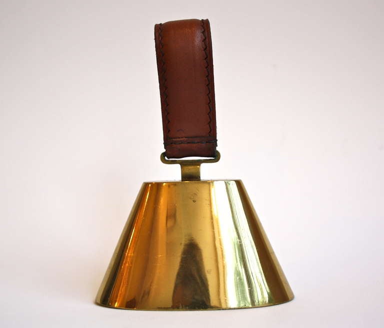 Great brass bell with the original leather handle.