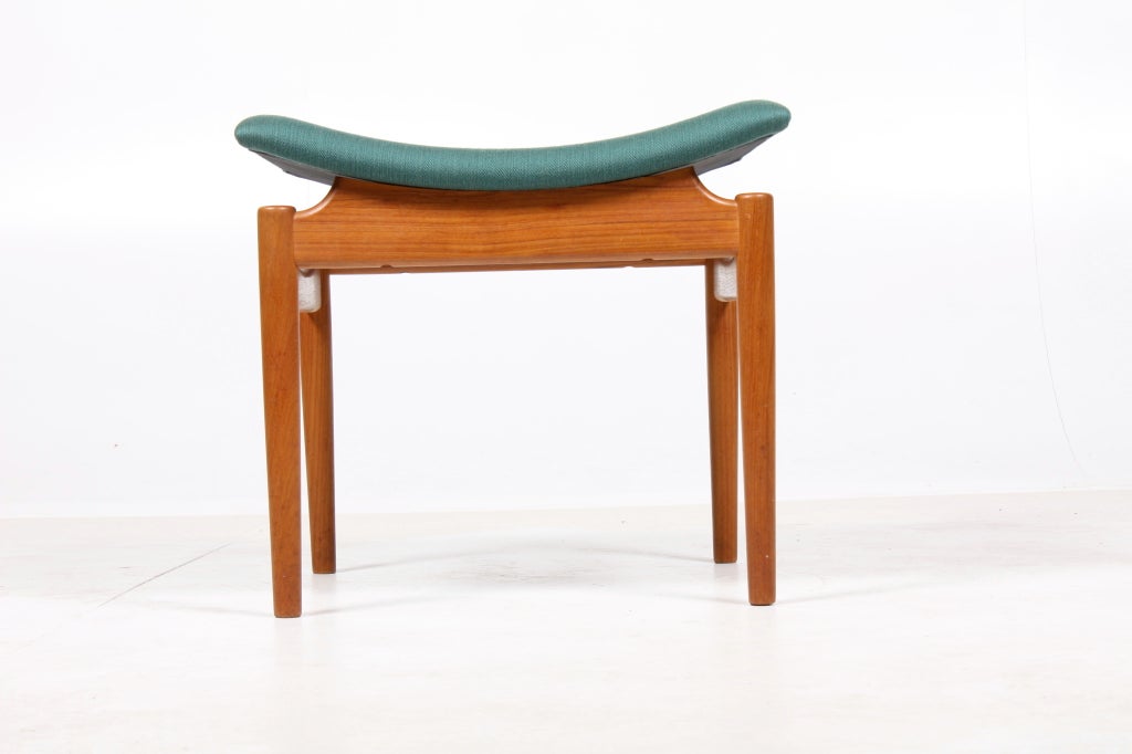 Teak and upholstery large stool by Finn Juhl. Made by mastercabinetmaker Niels Vodder this is an early example of the shapes Juhl perfected during the 1940s and 1950s