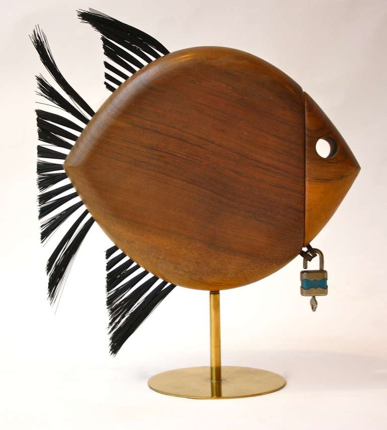 This wonderful fish bank is a excellent example of the skilled craftsmanship and thought that went to every object that came out of the Vienna based Carl Auböck workshop.  This walnut and brass fish with lovely detailed padlock is simply superb.