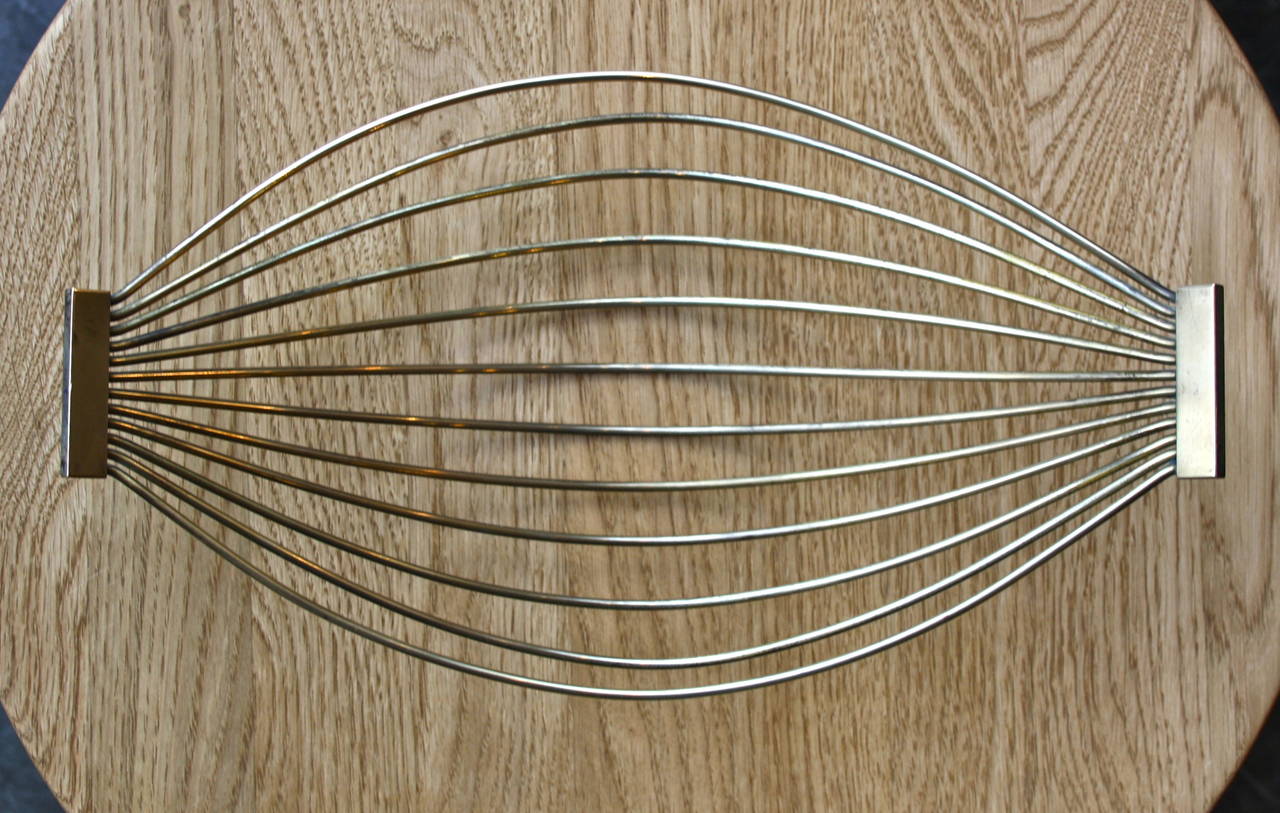 Sculptural simple brass basket by Carl Auböck.