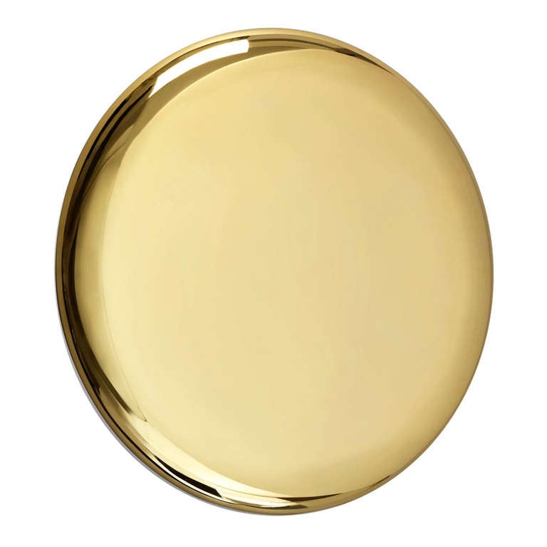 This sculptural vanity mirror by Michael Anastassiades is 18 carat gold plated and very easy to hang. Marked with Michael's unique stamp on the back, this wonderful piece can make any wall come alive.