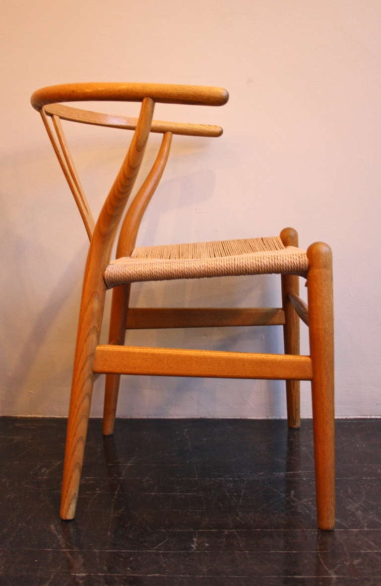 Set of six vintage oiled oak Wishbone chairs by Hans Wegner. All in great condition and with a lovely patina to the wooden frame.