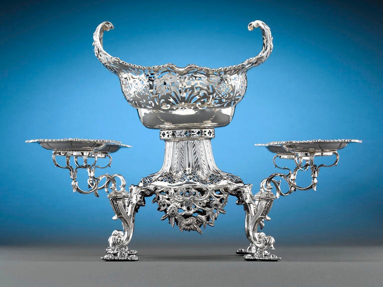 This enchanting George III Irish silver epergne is a masterpiece of Irish silver artistry. Crafted by William Homer of Dublin, this remarkably detailed design is executed with the utmost precision and delicacy, from the Rococo elements that seem to