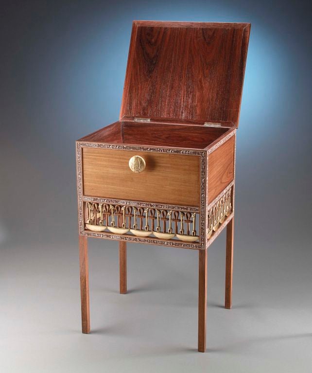 Modeled after the cabinet discovered in the tomb of King Tutankhamun by famed archeologist Howard Carter, this one-of-a-kind work was reportedly created for Carter himself. The cabinet is crafted of cedar and ebony and is beautifully inlaid with