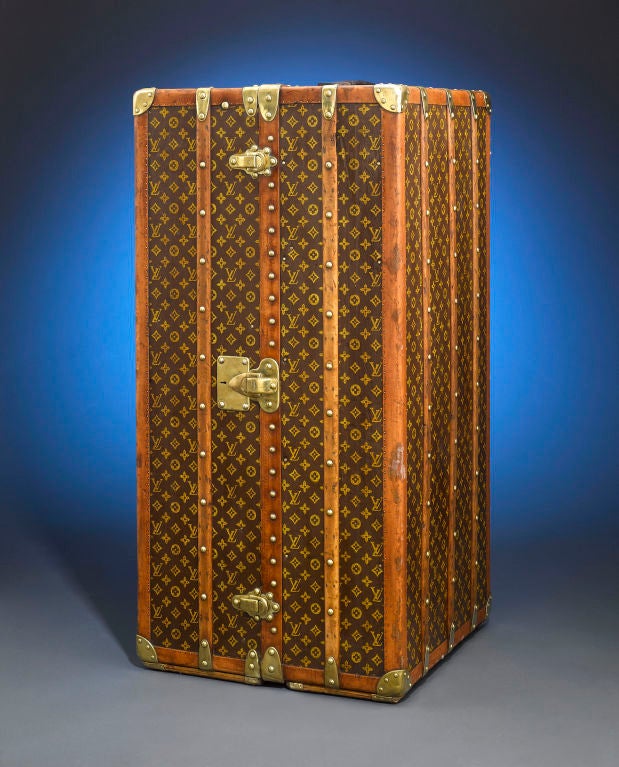 This rare and captivating vintage Louis Vuitton wardrobe trunk embodies the elegance and sophistication of a bygone era. Boasting the iconic 