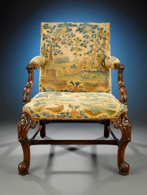 The creative spirit of Thomas Chippendale is embodied in this exceptional, antique George II period library chair from the collection of Benjamin F. Edwards, III. Crafted of luxurious Cuban mahogany and upholstered in beautiful period gros and petit